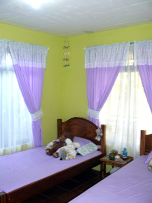 A chilren's bedroom has a bright color scheme.