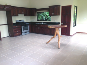 The kitchen has beautiful Guanacoste hardwood cabinetry.