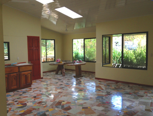 Here is the open interior with finished ceiling and large skylights. 