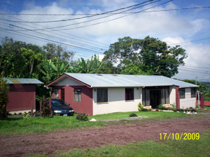 The house and separate neat storage bulding from uphill. 