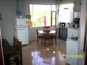 The new kitchen i large with view windows toward the lake.