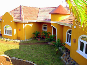 The home, now finished, is lavishly furnished and beautifully landscaped. 