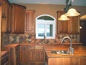 The kitchen has custom cabinetry. 