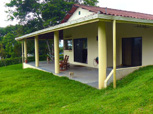 Sliding glass doors access the wide veranda from both the kitchen and the master bedroom.