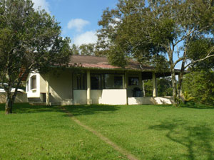 The home has a partially glassed wide veranda wrapping around the two lakeview sides. 