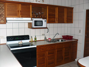 The kitchen has new appliances and much else needed. A laundry room is next to the kitchen.