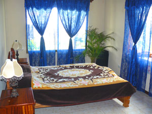 The master bedroom has large windows both to the west and north.