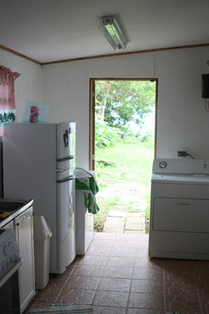 The kitchen door leads to the pleasant yard.