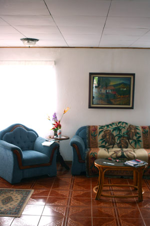 The living room is comfortably furnished and ready for moving in. 