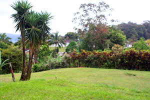 To the northwest are forested hills and the windsurfing end of Lake Arenal.