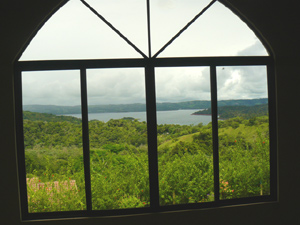 The "great room" has excellent lake views through its large arching window.