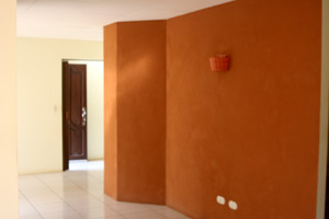 An attractively shaped and painted wide hallway leads to the bedrooms.