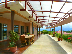 A translucent roof extends the long volcano-view patio area. 