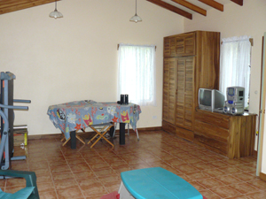 The interior of the cottage is of open design with a kitchenette and an enclosed bathroom.