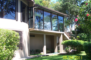 The lakeview side of the house has grand circular family room on the second floor and a glassed sun porch with an outside stairway as well as inner access.