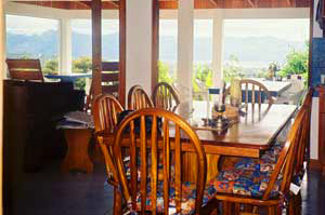 The dining area also has fine views past the deep veranda to the lake and mountains.