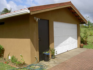 The automatic 1 1/2 car garage contains the laundry.