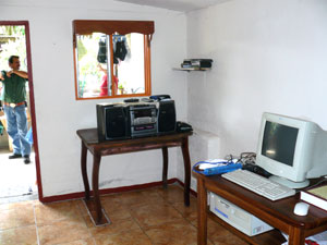 The computer room is between the television room and the laundry area. 