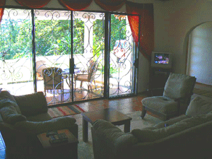 The lakeview living room's sliding doors lead to a covered patio.