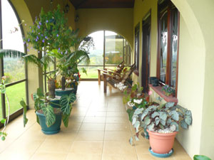 The glassed-in lake-side veranda has etched-glass doors to the family room. 