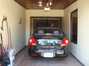 There are two locking single-car garages, one on either side of the entry.