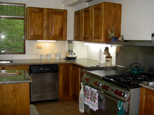 The wonderful kitchen includes a Wolfe professional gas range.