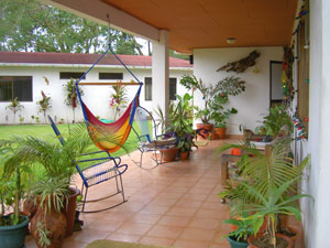 The wide veranda is a great place to enjoy the beautiful surroundings and lake view.