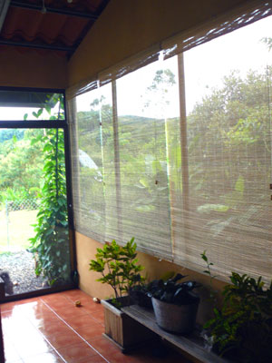 The newly glassed-in back porch looks out on beautiful rololing hills and three dormant volcanos.