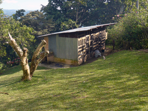 In one corner of the grounds is a large, well-built chicken coop.