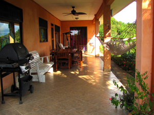 The house has a wide veranda from which to enjoy the balmy tropical weather and wide lake and mountain vista.