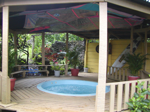 The large partly open party room has a generous jacuzzi. 