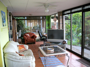 The wide living room has floor to ceiling glass for the lake views.