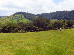 A farmhouse sits in trees at a large finca in the hills just past Libano. 