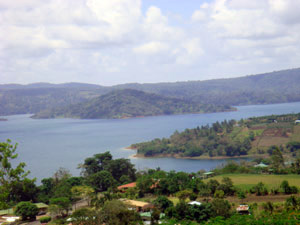 Below the lots are the village of San Luis, San Luis Cove - site of a small marina - and Lake Arenal, with Santa Elena Island prominent in its position on the other side of the lake.