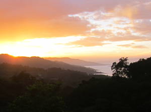 A brilliant sunset and the lake are seen from the property.