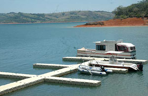 The marina has a floating dock in a protected cove of Lake Arenal.