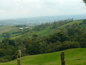 To the northwest are Tilaran, wind turbines atop hills beyond the town, and the Guanacaste lowlands. 