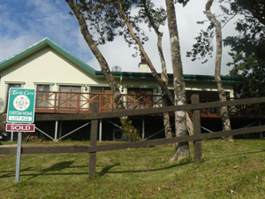 The original model home is located at the top of the road to the launch area and dock.