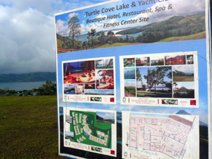 The sign near the gated entrance shows the intent to provide a boutique hotel, clubhouse, restaurant, and fitness center.