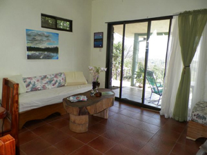 The living room has sliding doors out to the covered patio.