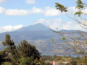 The dormant volcano Tenorio rises beyond the northwest corner of Lake Arenal.