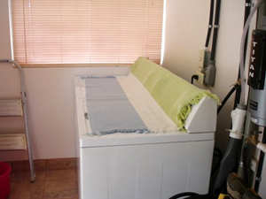 The laundry room has washer, dryer and on-demand hot water heater.