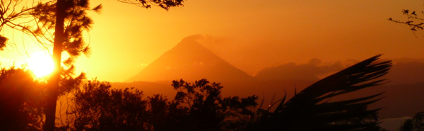 The sun rising behind the Arenal Volcano makes a beautiful view from this property.