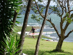 A windsurfer leaves the famous windsurfing end of Lake Arenal.