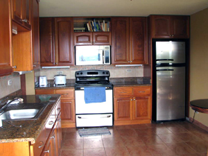 The kitchen is fully outfitted and has new appliances.