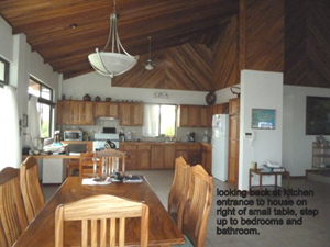 The kitchen as seen past the living room from the viewing lounge.